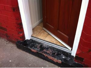 Wooden Door Frame Repair (3 of 3) - The finished repair painted to look like new, giving the door a new lease of life