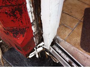 Wooden Door Frame Repair (1 of 3) - Rotted wooden door frame of a terraced Burnley house in need of repair