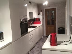 Modern Kitchen - Contemporary fitted kitchen for a Preston home, making good use of available space