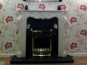 Decorative fireplace, wall-papering and laminate flooring for a Penwortham property Photo - Decorative fireplace, wall-papering and laminate flooring for a Penwortham property
