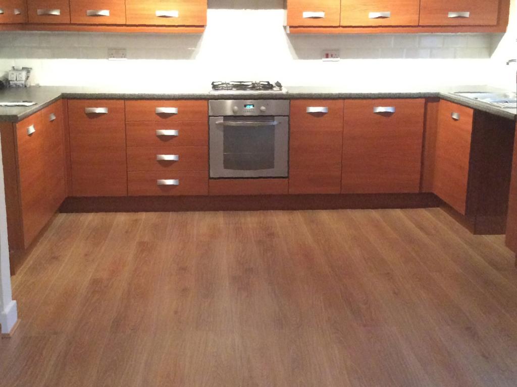 Laminate flooring installed to a kitchen and living area in Leyland, near Preston Photo - Laminate flooring installed to a kitchen and living area in Leyland, near Preston